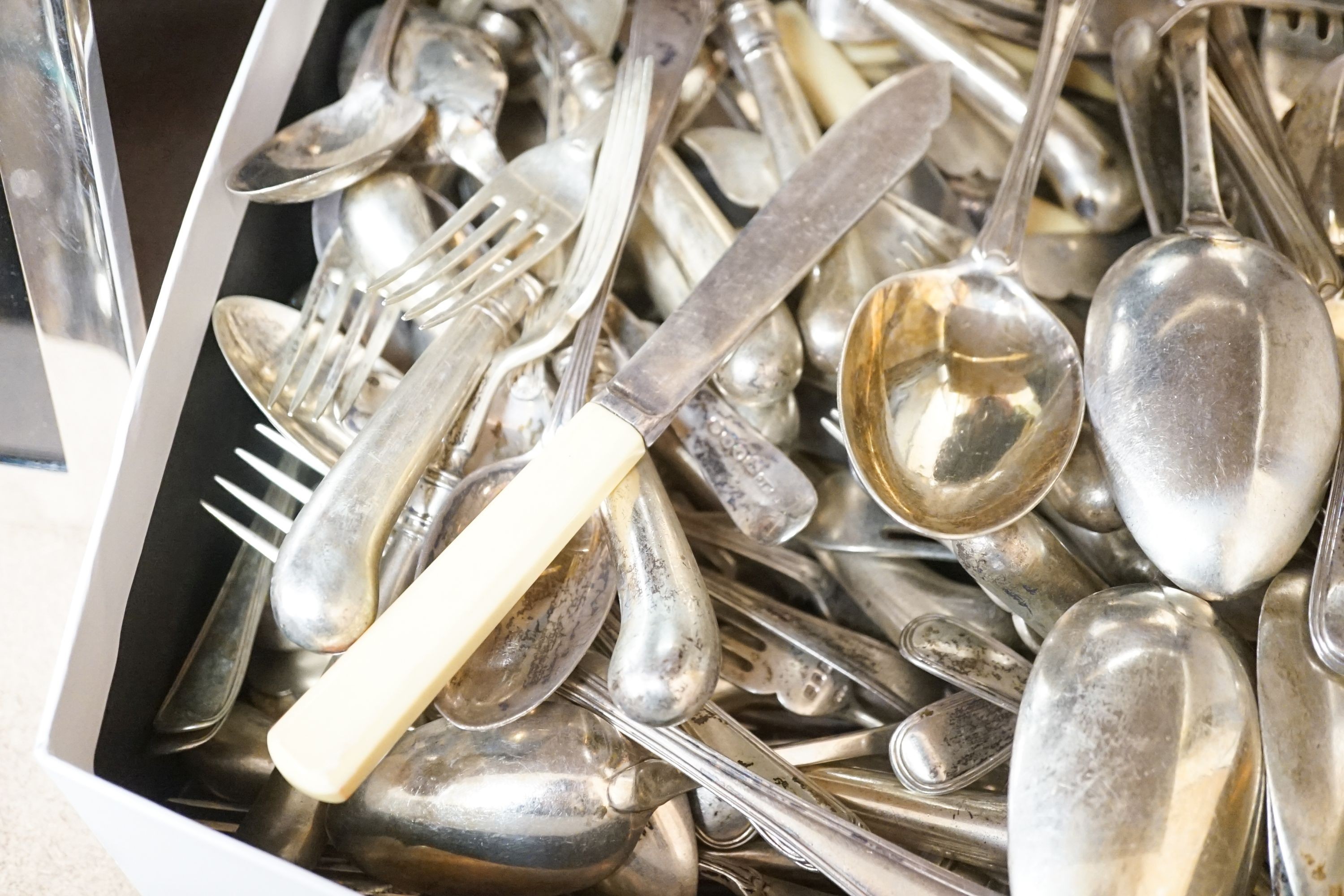 A mixed quantity of 19th century and later silver cutlery, including pistol handled fish eaters and pistol handled steel table and dessert knives, various date and makers, including a set of seventeen George IV table for